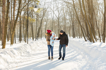 Fototapeta na wymiar family outdoors in winter landscape