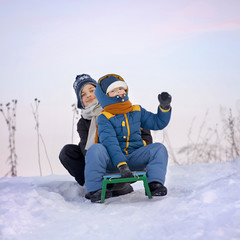 Fototapeta na wymiar happy boys on sled