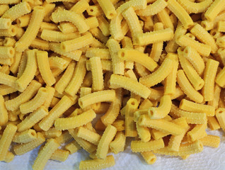 Homemade macaroni is a yellow dry pasta