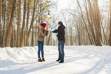 happy young family spending time outdoor in winter