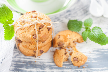 cookies and tea in a cup on a concrete background, selective focus
