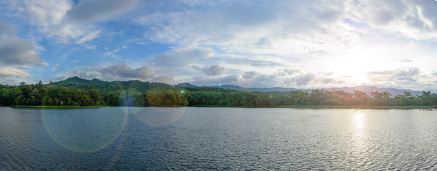 Panorama of lake view park with flare filter 
