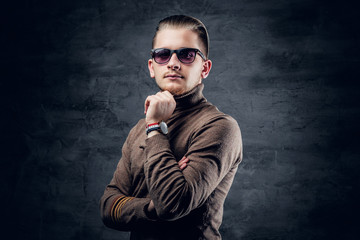 Fototapeta premium A man in sunglasses in turtle-neck sweate.