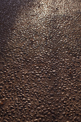 Seamless tile pattern background of small stones on sidewalk or