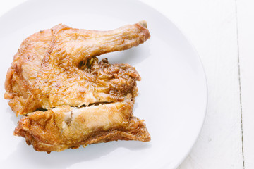 Delicious chicken on wooden table