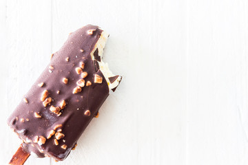 Bite Ice cream chocolate on wooden background