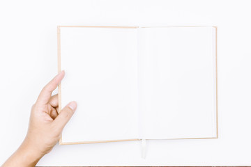 Hands hold the book on white background