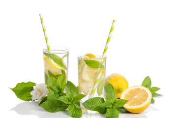 Two glasses  with  lemonade . Lemon and mint isolated on white