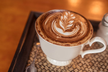 Closeup of beautifully served cup of latte coffee
