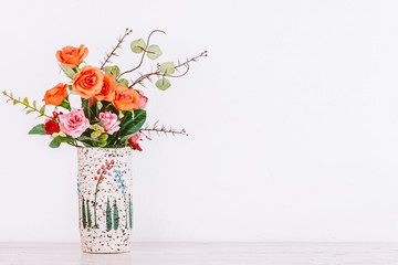 Rose Wedding Bouquet in flower pot on wooden table
