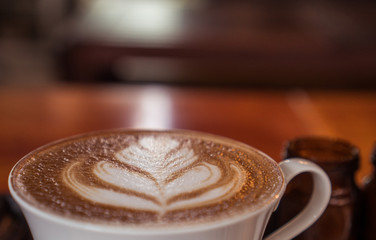 Closeup of beautifully served cup of latte coffee