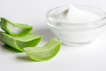 aloe vera - leaves and cream isolated on white background