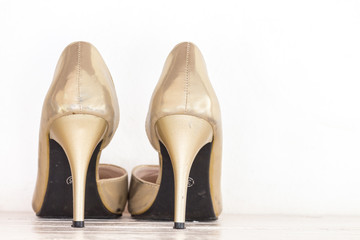 Female shoes on wooden table