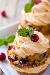Homemade autumn cranberry pumpkin cupcakes with cream cheese
