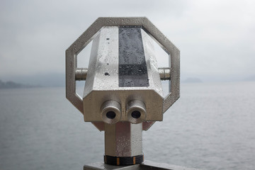 Stationary observation binoculars with rain drops