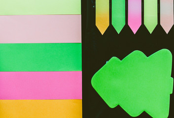 Blank colorful sticky notes set on black background