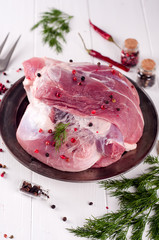 Raw juicy meat on an iron plate o