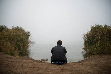 Young man near lake