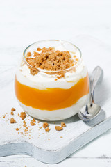 dessert with pumpkin, whipped cream and cookies, vertical