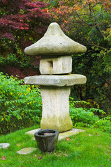 Fototapeta na wymiar stone pagoda, stone tower / A view of stone pagoda, stone tower in the garden 