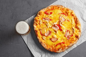 Tasty pizza with beer, top view