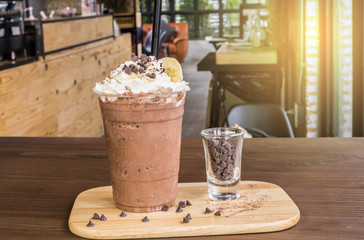 Glass of fresh banana cocktail on glass