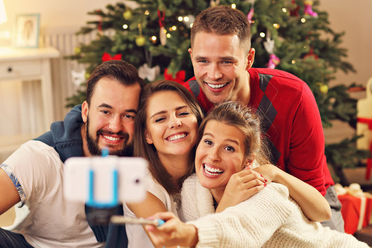 Group of friends taking selfie during Christmas
