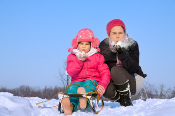 Happy family enjoying in winter