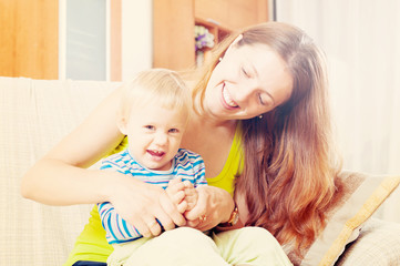 Portrait of happy mother with toddler