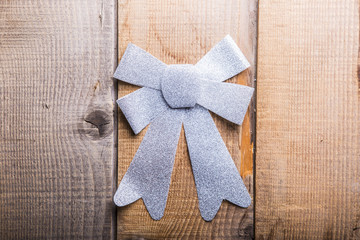 Christmas decorations bow on  wooden background