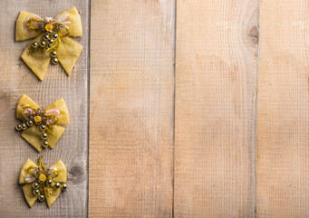 Christmas decorations bow on  wooden background