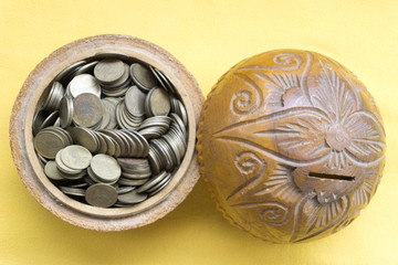 Old bowl filled with Thai baht coin