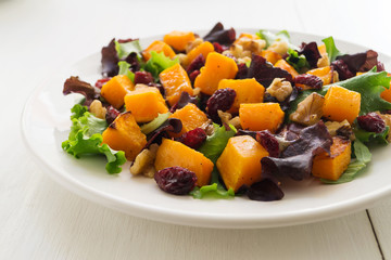 Autumn salad with roasted butternut squash, cranberry and walnut