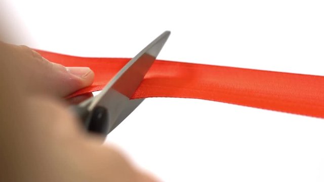 grand opening - scissors cutting red ribbon