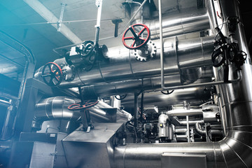 different size and shaped pipes and valves at a power plant