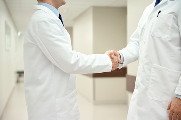 close up of doctors making handshake