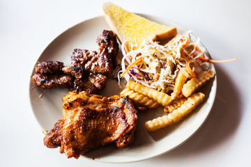 Grilled steak and vegetable salad on white plate