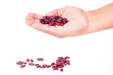 lady hold kidney beans in hand on white background