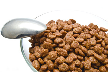 Chocolate cereal balls this spoon in the bowl