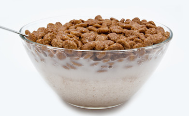 Chocolate cereal balls this milk  in the bowl