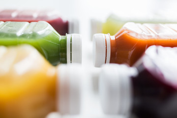 bottles with different fruit or vegetable juices