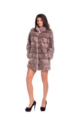 Full length portrait of beautiful brunette women in short mink c
