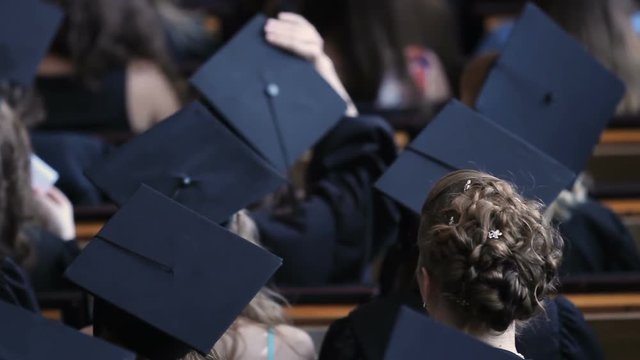 Graduating students feeling nervous before receiving higher education diplomas