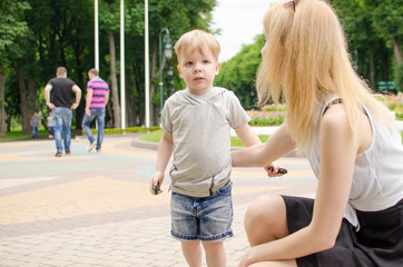 Small baby bo is having fun in with his mother