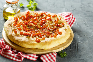 Focaccia bread with tomatoes and garlic