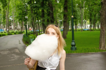 Young woman with the cotton candy