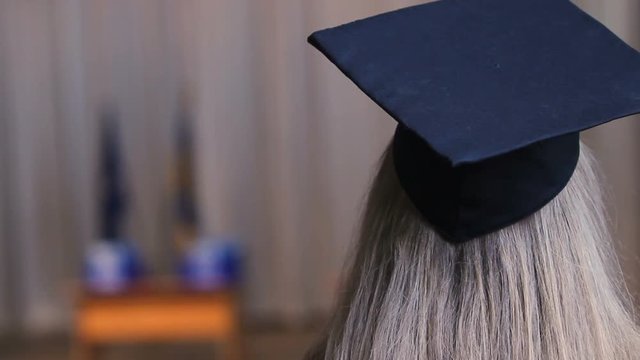Blonde woman in academic cap, female ready to receive higher education diploma