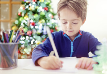 Writing a Christmas list letter to Santa Claus