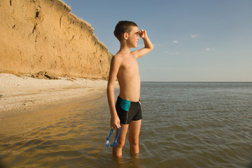 young boy kid child at sea