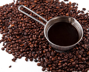 Turk with coffee beans isolated on white background